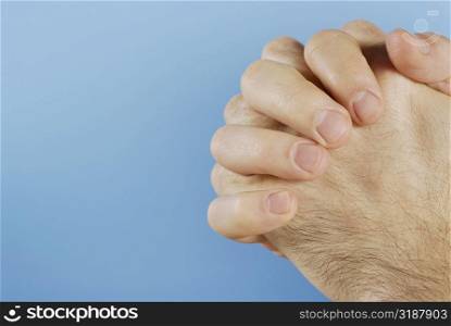 Close-up of person&acute;s hands clasped