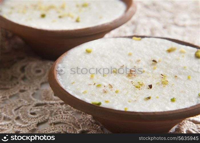 Close-up of phirni served in bowls on table