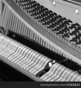 Close-up of piano hammers and tuning pins