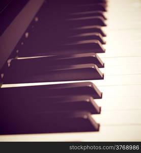 Close up of piano keys with retro filter effect