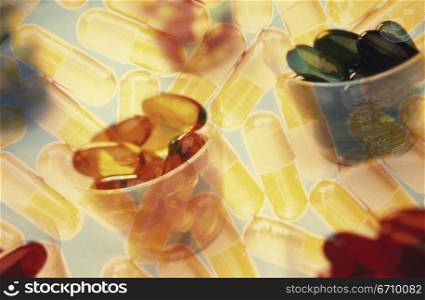 Close-up of pills and capsules in cups
