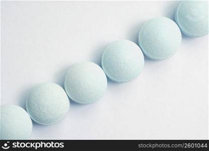 Close-up of pills in a row