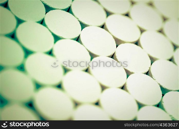 Close-up of pills in a row