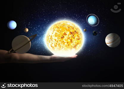 Close up of planet sun system in your hand. Sun system