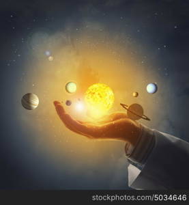 Close up of planet sun system in your hand. Sun system