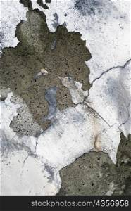 Close-up of plaster peeling of a wall