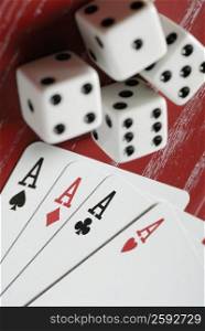 Close-up of playing cards with two pairs of dice