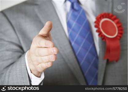 Close Up Of Politician Reaching Out To Shake Hands