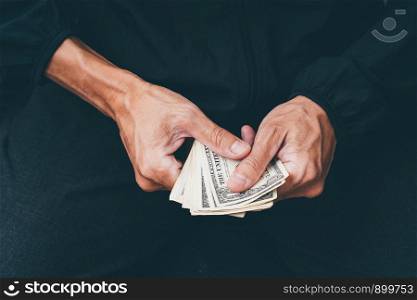 Close up of poor man hand with small money