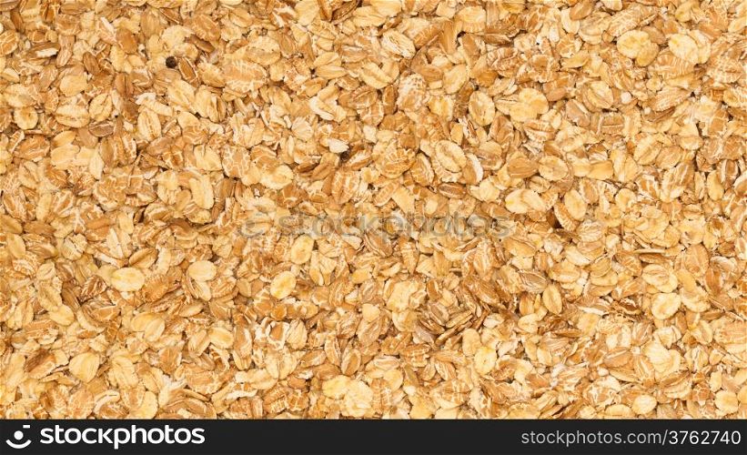 Close up of porridge oats as background or texture. Diet and healthy nutrition.