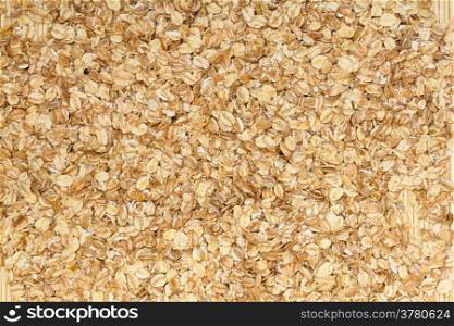 Close up of porridge oats as background or texture. Diet and healthy nutrition.