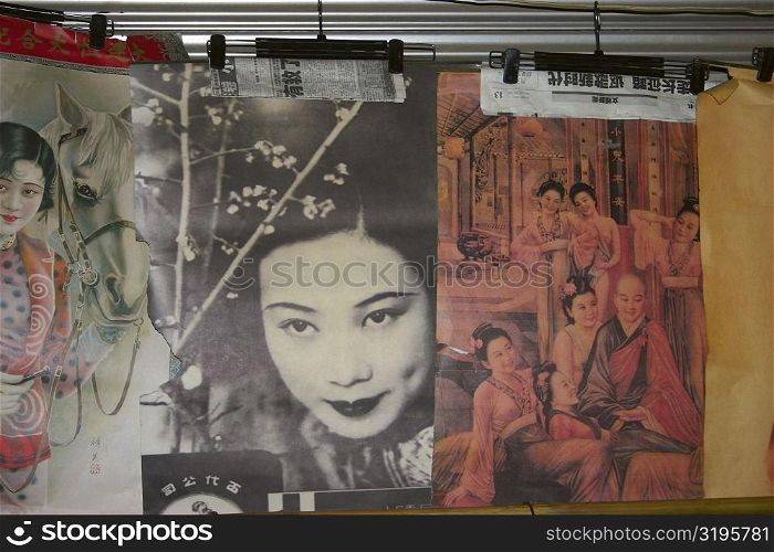 Close-up of posters at a market stall, Xi&acute;an, Shaanxi Province, China