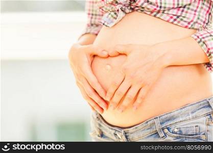 Close up of pregnant woman's belly