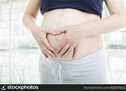 Close up of pregnant young woman