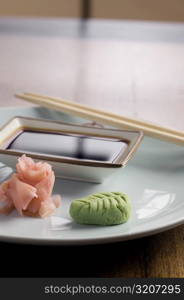 Close-up of prepared fish with a bowl of dip