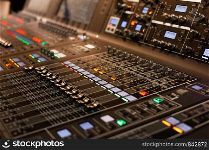 Close up of professional sound mixing console. Selective focus.