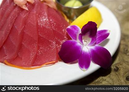 Close-up of raw fish slices in a plate