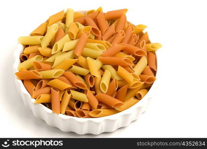 Close-up of raw penne pasta in a bowl