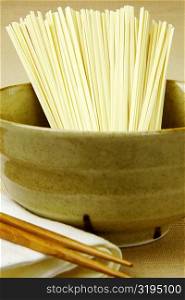 Close-up of raw spaghetti in a bowl
