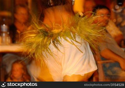 Close-up of rear of a young woman dancing, Moorea, Tahiti, French Polynesia, South Pacific