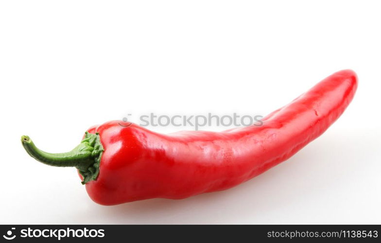 Close-Up Of Red Chili Pepper Against White Background