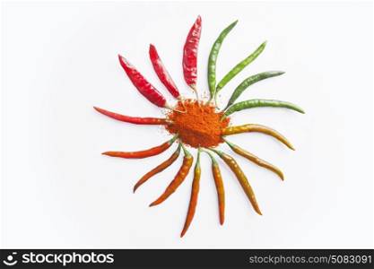 Close-up of red chilli powder with chilli peppers arranged in circle
