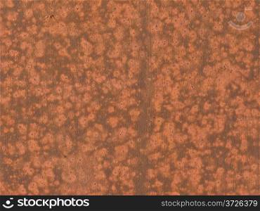 Close up of red colored corroding metal surface