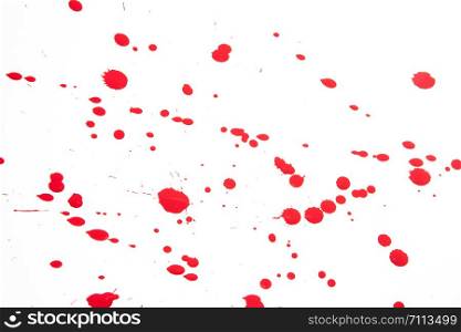 close up of red drops on white background