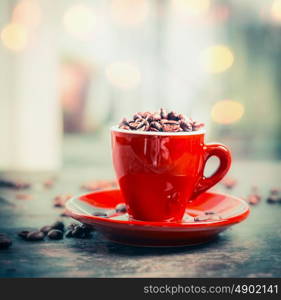 Close up of Red espresso coffee cup on table at window background