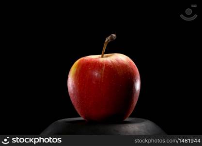 Close up of red organic fresh apple on black background. Healthy food concept. Close up of red organic fresh apple on black background. Healthy food concept.