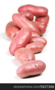 Close up of red potatoes on white background