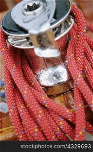 Close-up of red rope around crank