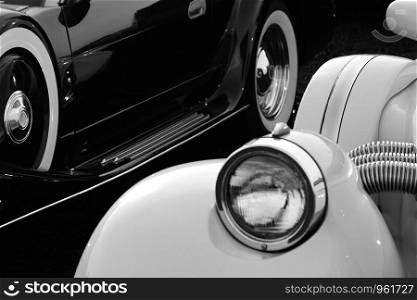 Close-up of retro cars in black and white