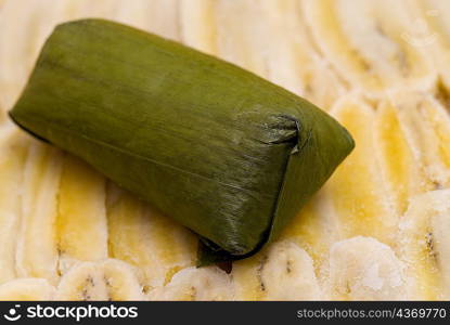 Close-up of rice dumpling on banana slices