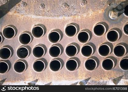 Close-up of rivets and holes on a metal surface