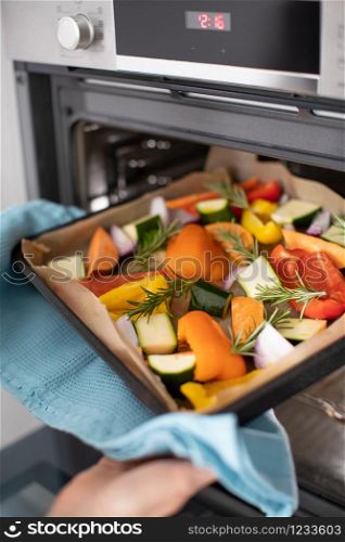 Close Up Of Roasting Tray Of Vegetables For Vegan Meal In Oven