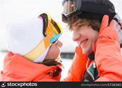 Close-up of romantic young couple about to kiss during winter