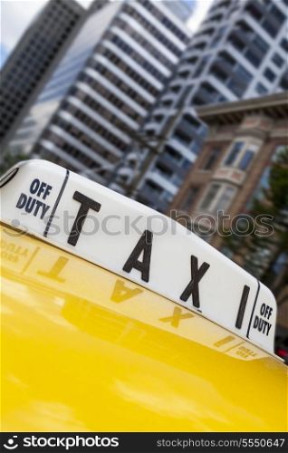 Close up of roof sign on moving New York City yellow taxi cab
