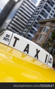 Close up of roof sign on moving New York City yellow taxi cab