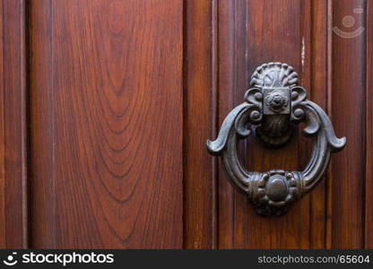 Close up of rustic old door in Florence, Italy.