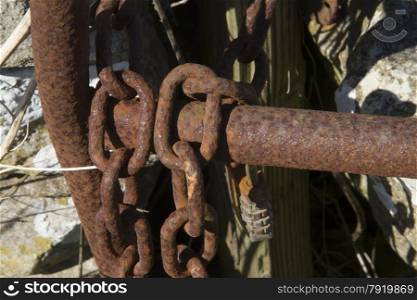 Close up of rusty gate and chain