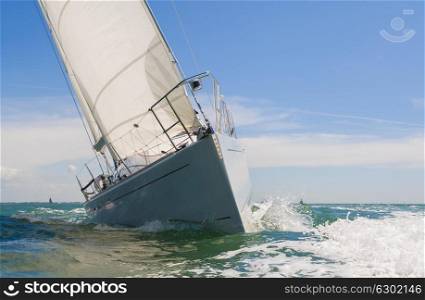 Close up of sailing boat, sail boat or yacht at sea on summera??s day with blue sky