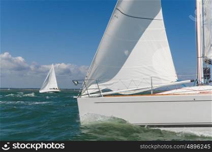 Close up of sailing boat, sail boat or yacht at sea with another white boat in the background
