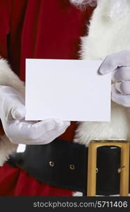 Close Up Of Santa Claus Holding Blank Invitation