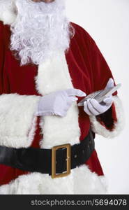 Close Up Of Santa Claus Holding Calculator