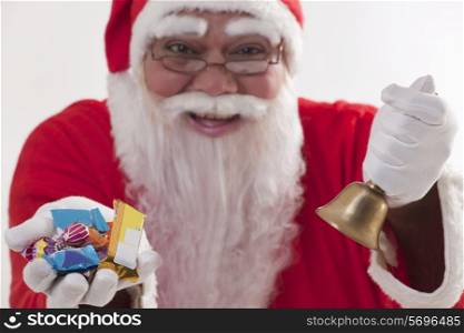 Close-up of Santa Claus offering sweets