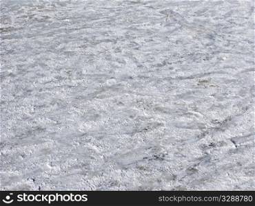 Close up of scratched snowy ice surface background