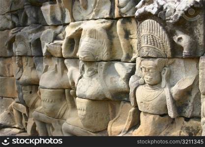 Close-up of sculptures carved on the wall of a temple, Angkor Wat, Siem Reap, Cambodia
