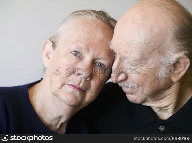 Close-up of senior couple focusing on worried woman