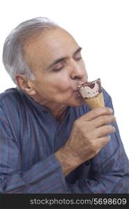 Close-up of senior man enjoying ice cream